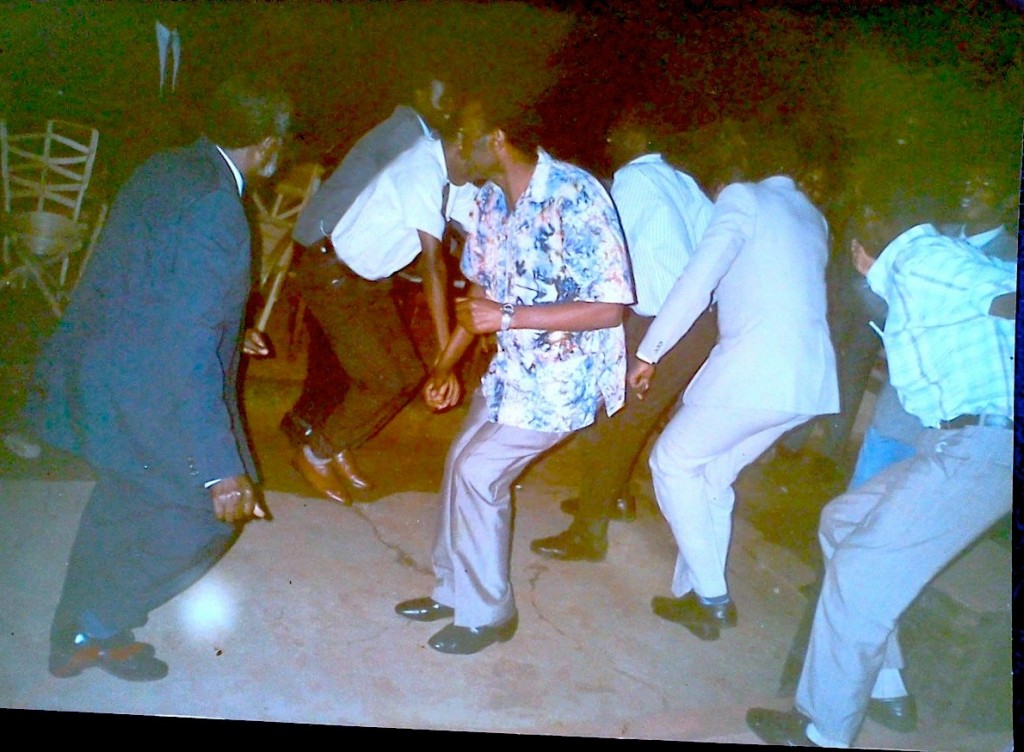 At my brother's graduation party. Dad in a blue suit, the guy facing him uncle Baira, also his best man. They danced Kikiga dance until the floor cracked as you can see. 